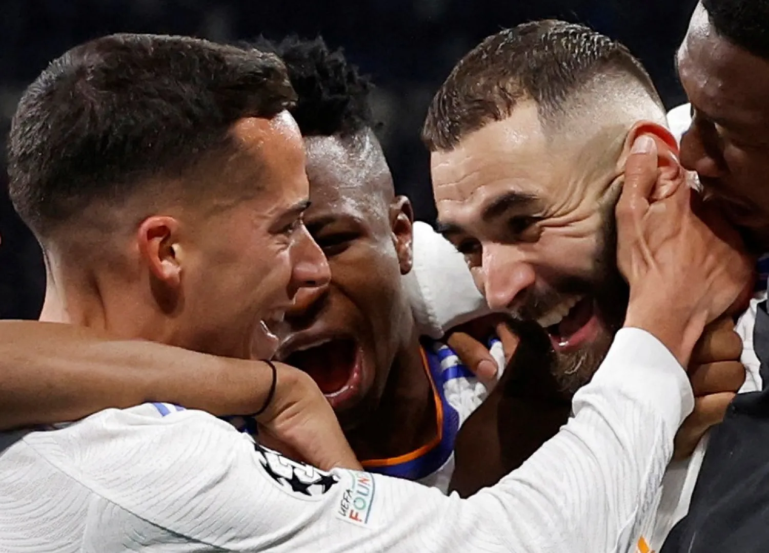 Football - Champions League - Quarter Final - Second Leg - Real Madrid v Chelsea - Santiago Bernabeu, Madrid, Spain - April 12, 2022 Real Madrid's Karim Benzema celebrates scoring their second goal with teammates (Reuters)