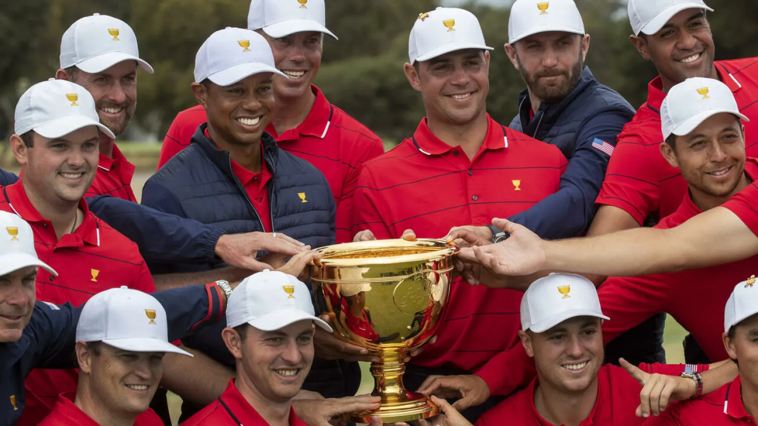 The USA team pose with the Presidents Cup after winning in Melbourne in 2019 SIMON BAKER AFP
