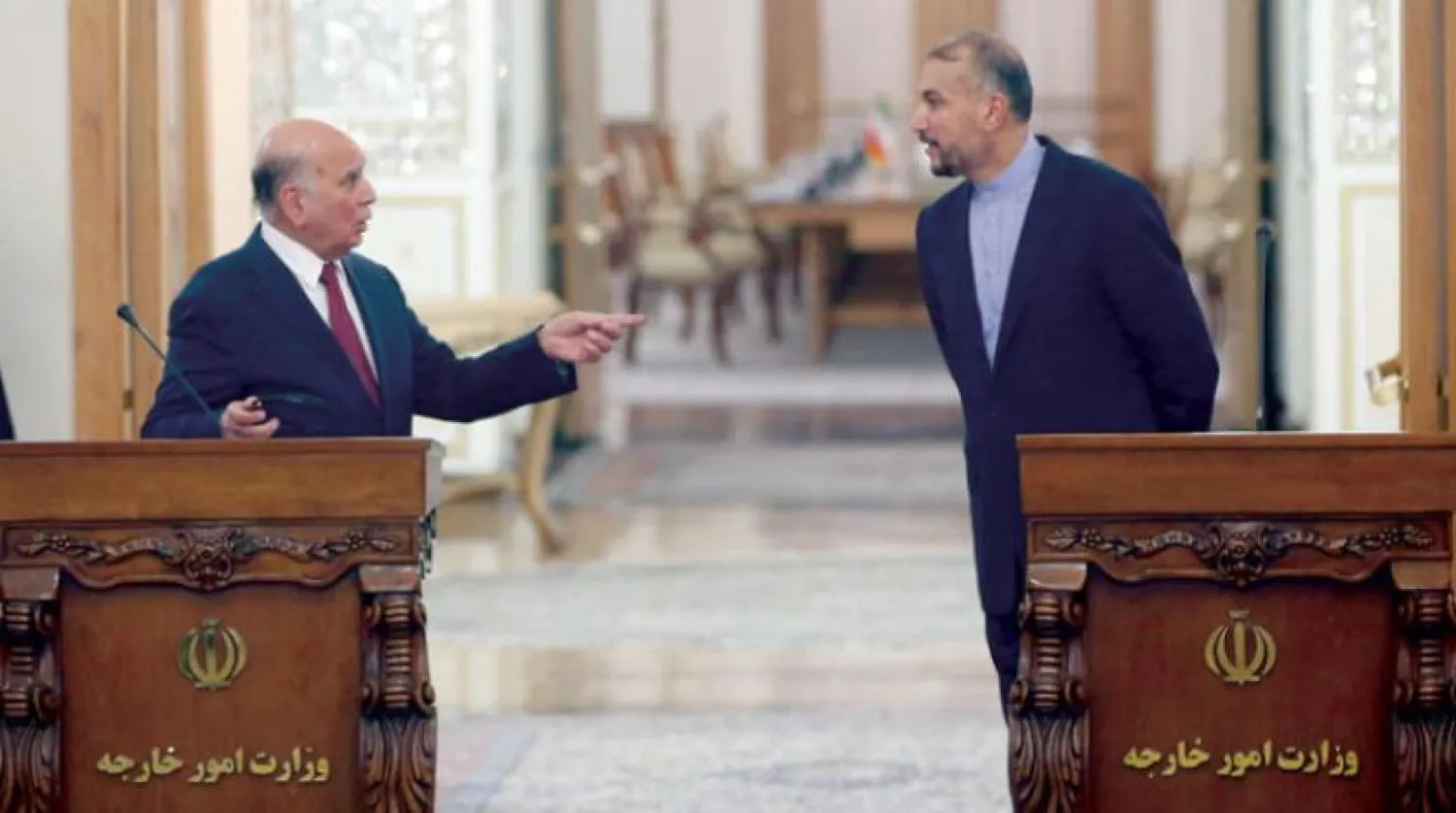 Iraqi Foreign Minister Fouad Hussein speaking to his Iranian counterpart, Hossein Amir-Abdollahian, at a press conference in Tehran on Wednesday (EPA)