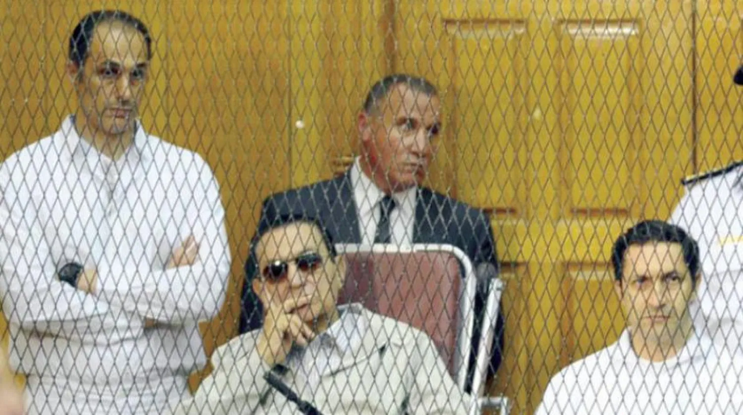 Hosni Mubarak with his sons at court, Egypt (File photo: AP)