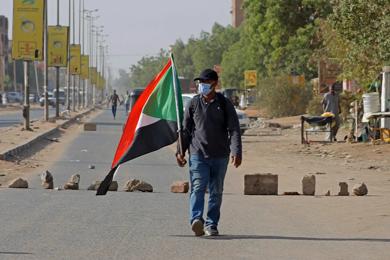 A Sudanese protester takes part in a rally against military rule on the anniversary of previous popular uprisings, in the capital Khartoum on April 6, 2022. (AFP)