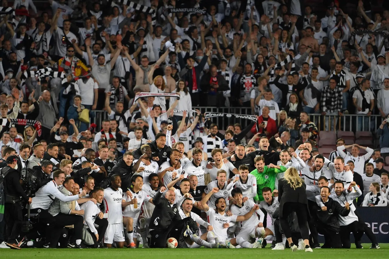 Eintracht Frankfurt's players celebrate at the end of the Europa League quarter final second leg football match between FC Barcelona and Eintracht Frankfurt at the Camp Nou stadium in Barcelona on April 14, 2022. (AFP)