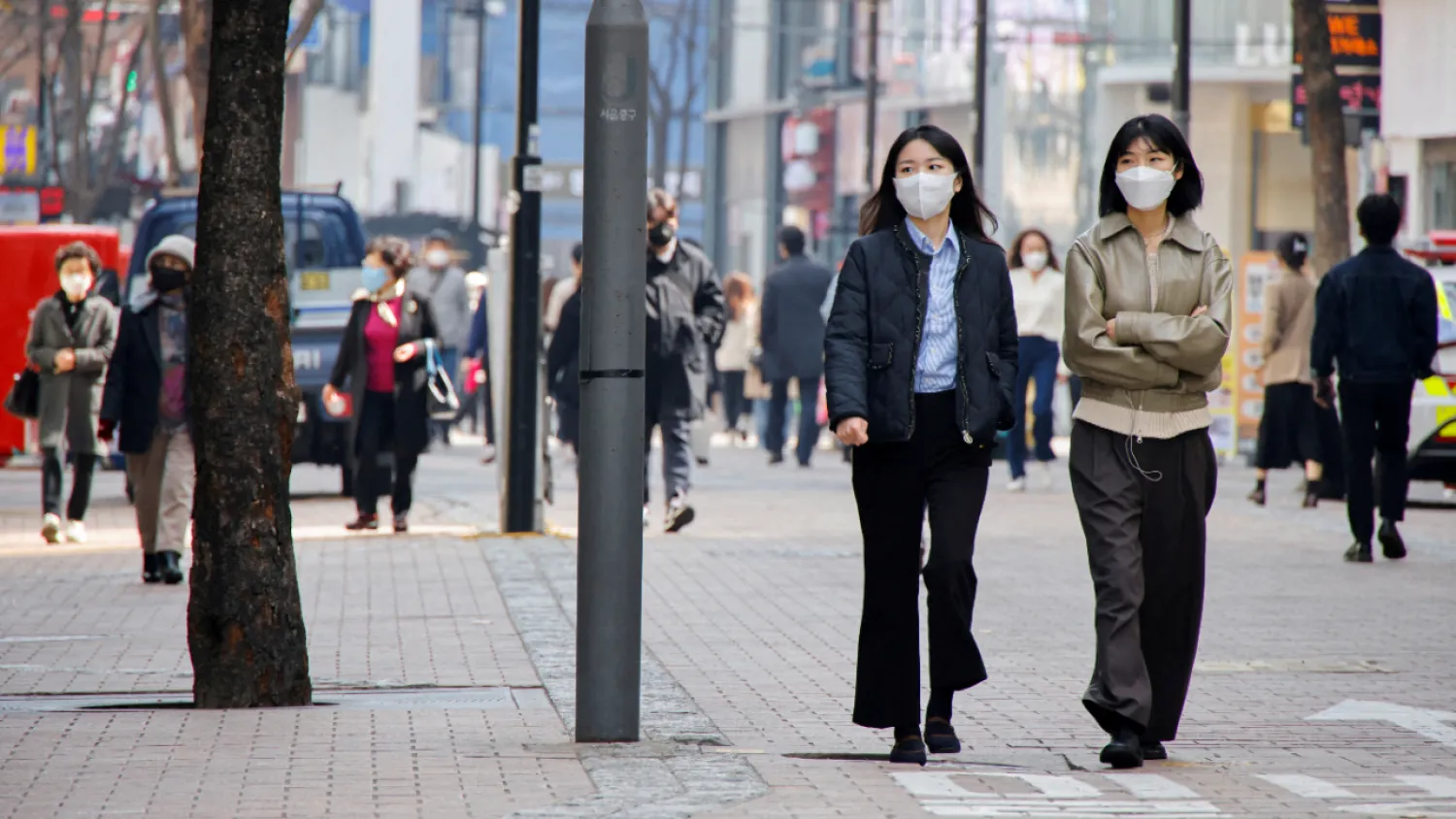 Women wearing masks walk in a shopping district amid the Covid-19 pandemic in Seoul, South Korea. Credit: Reuters Photo
