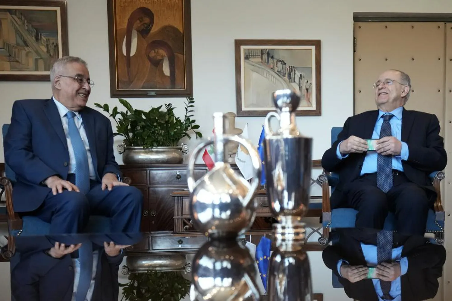 Cyprus' foreign minister Ioannis Kasoulides, right, and his Lebanese counterpart Abdallah Bou Habib talk during their meeting at the foreign ministry house in Nicosia, Cyprus, Friday, April 15, 2022. Bou Habib is in Cyprus for one-day visit. (AP Photo/Petros Karadjias)
