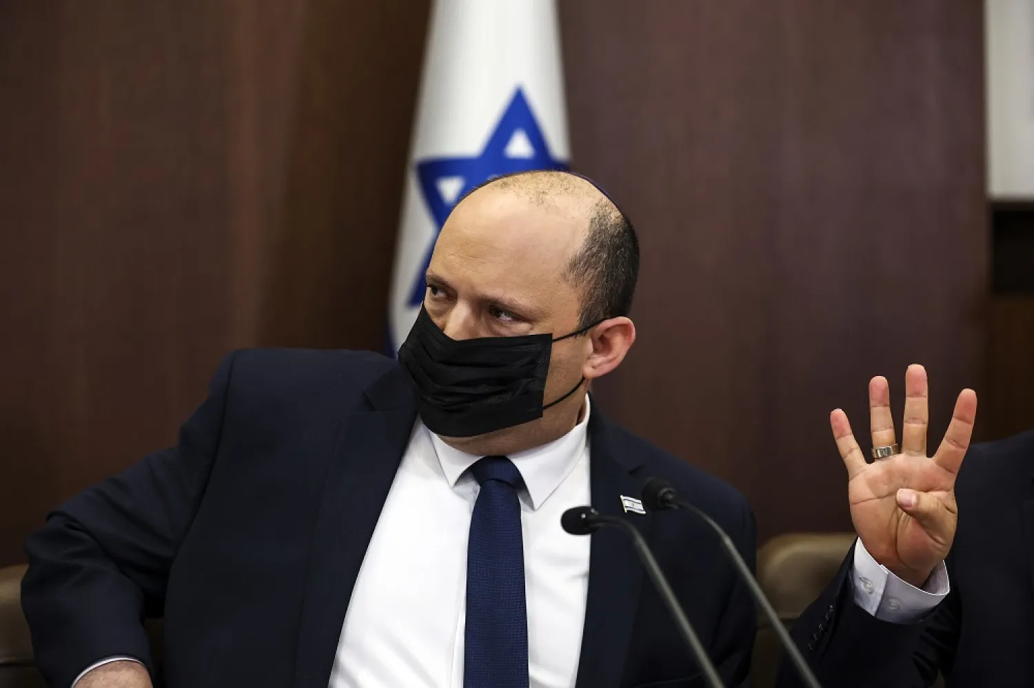 Israeli Prime Minister Naftali Bennett gestures as he attends a cabinet meeting at the Prime Minister's office in Jerusalem Sunday, April 10, 2022. (AP)