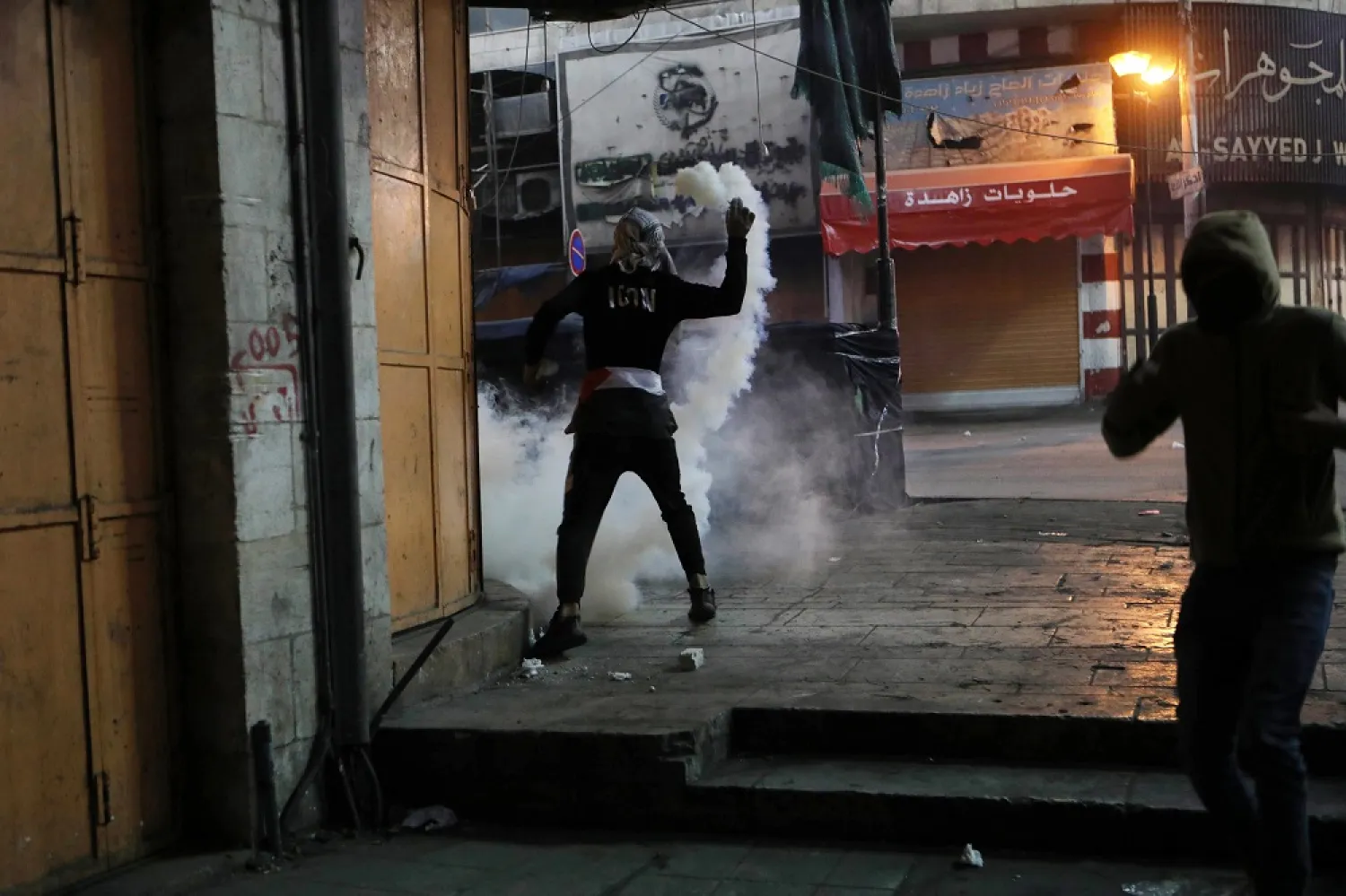 17 April 2022, Palestinian Territories, Hebron: Palestinian protesters clash with Israeli forces following a protest in solidarity with prisoners in Israeli jails marking Palestinian Prisoner's Day. (dpa)