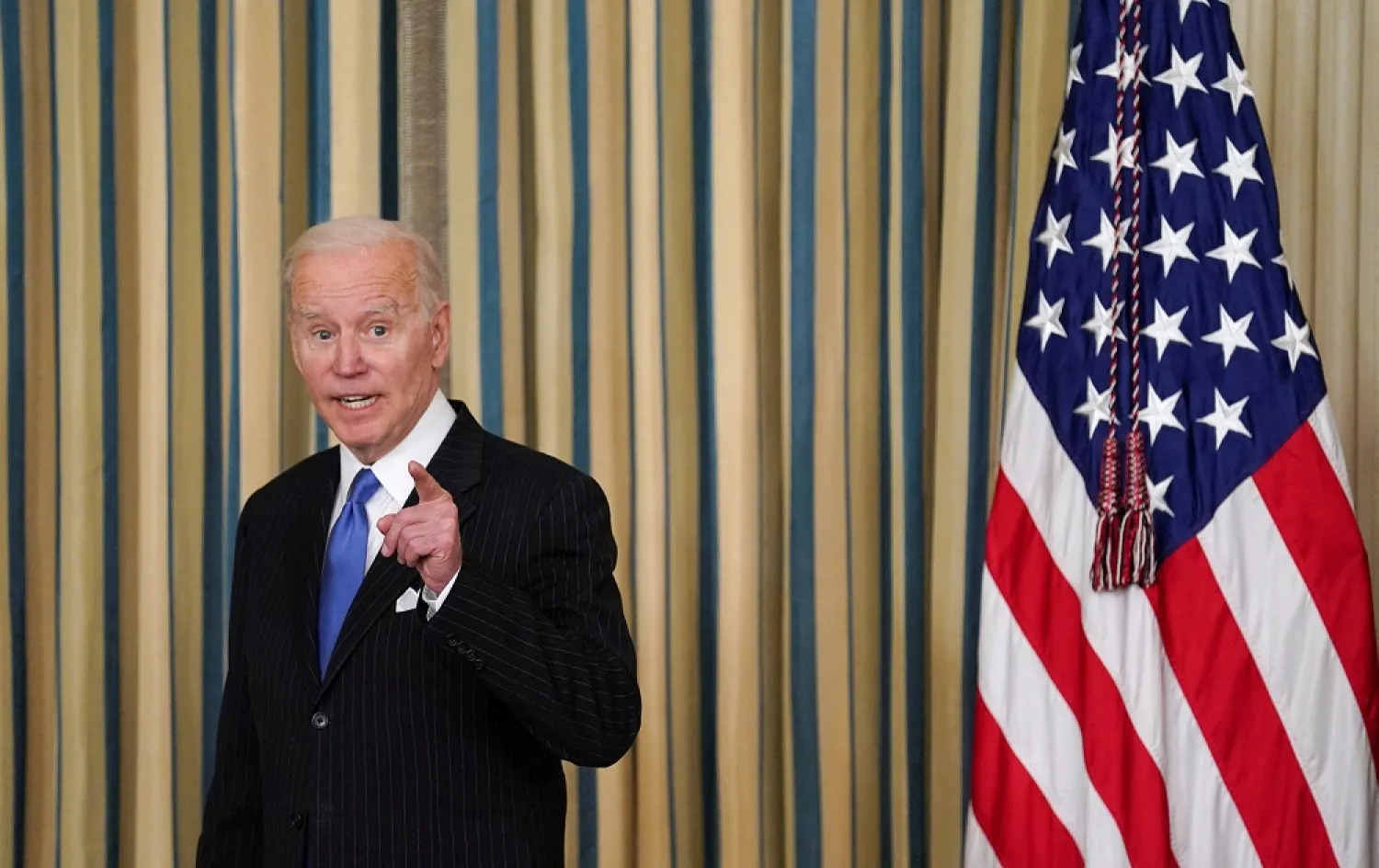 President Joe Biden answers a question after signing into law H.R. 3076, the "Postal Service Reform Act of 2022" at the White House in Washington, US, April 6, 2022. (Reuters)