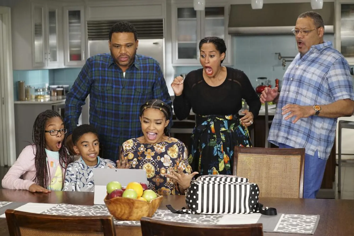 This image released by ABC shows, seated from left, Marsai Martin, Miles Brown and Yara Shahidi and, standing from left, Anthony Anderson, Tracee Ellis Ross and Laurence Fishburne in "black-ish." (ABC via AP)