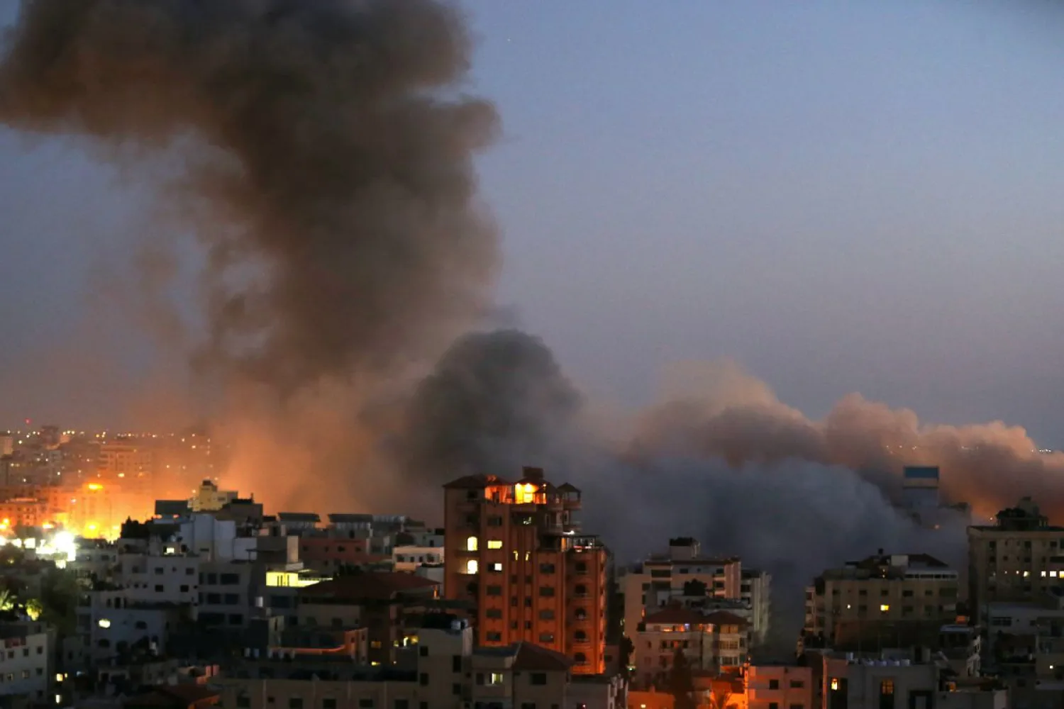 Smoke rises from a building after it was destroyed in an Israeli airstrike in Gaza. Reuters file photo