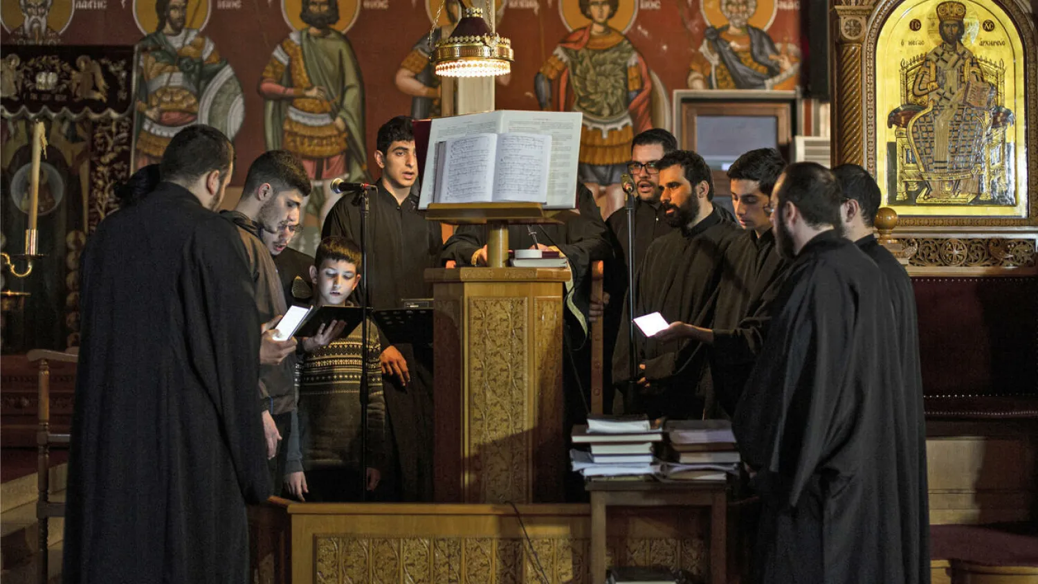 Members of the Cypriot Melodists Byzantine Choir chant at the Greek Orthodox Church of Ayia Napa (Panagia Church) Lisa GOLDEN AFP
