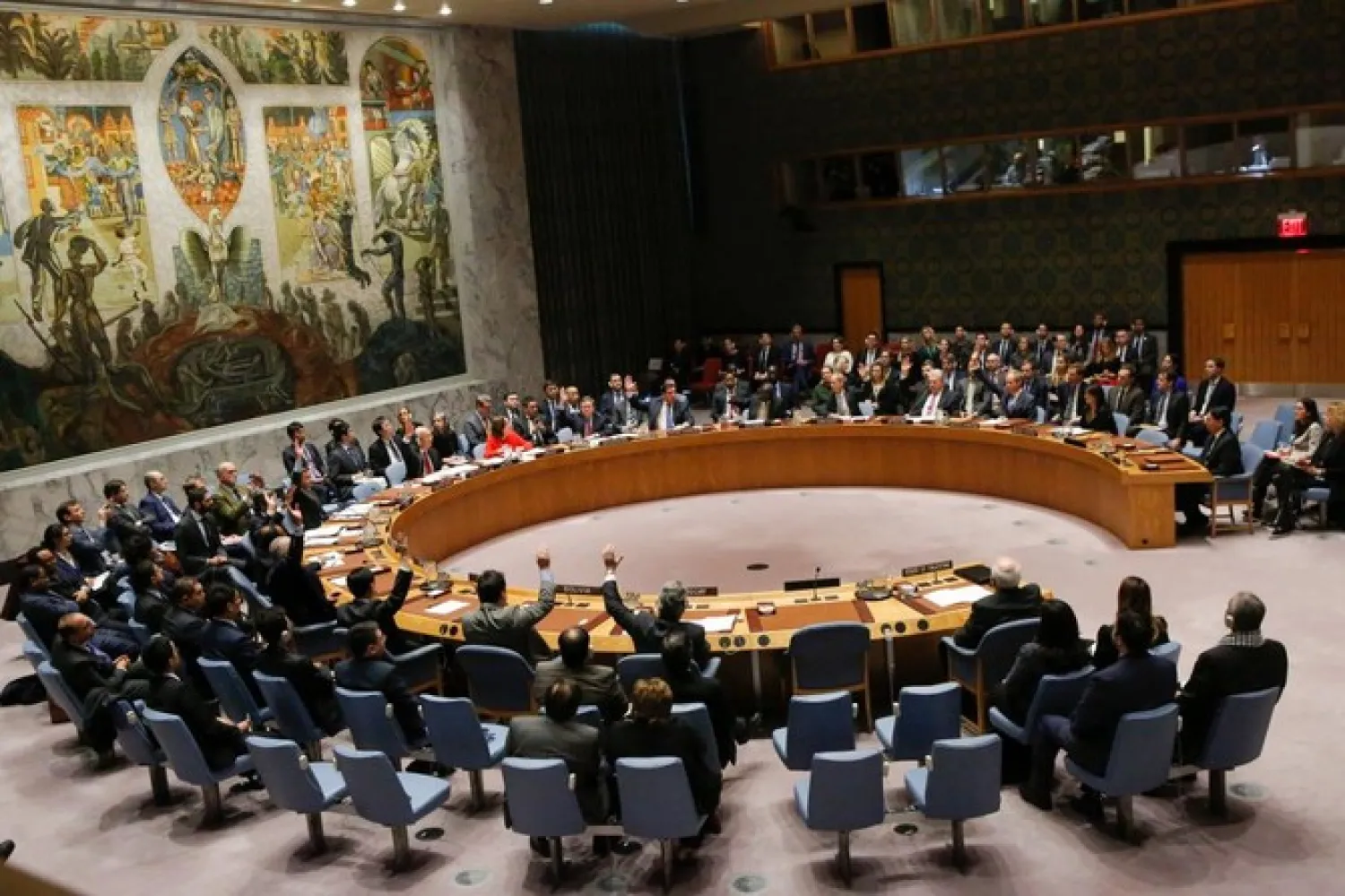 FILE: Members of the UN Security Council raise their hands as they vote on a draft resolution that would reject US President Donald Trump's decision to recognize Jerusalem as the capital of Israel during a meeting on the situation in the Middle East including Palestine on December 18, 2017, at UN Headquarters in New York. (AFP)
