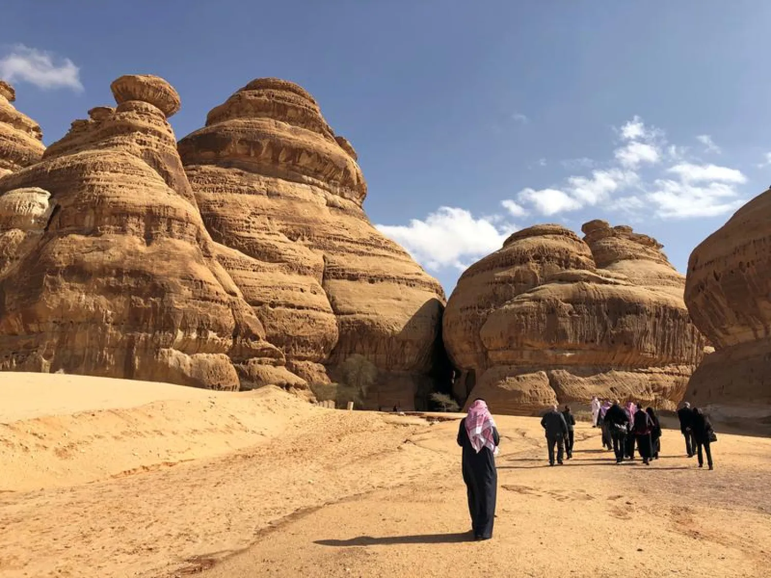  Visitors walk outside the tombs at the Madain Saleh antiquities site, AlUla, Saudi Arabia February 10, 2019. Picture taken February 10, 2019. REUTERS/Stephen Kalin
