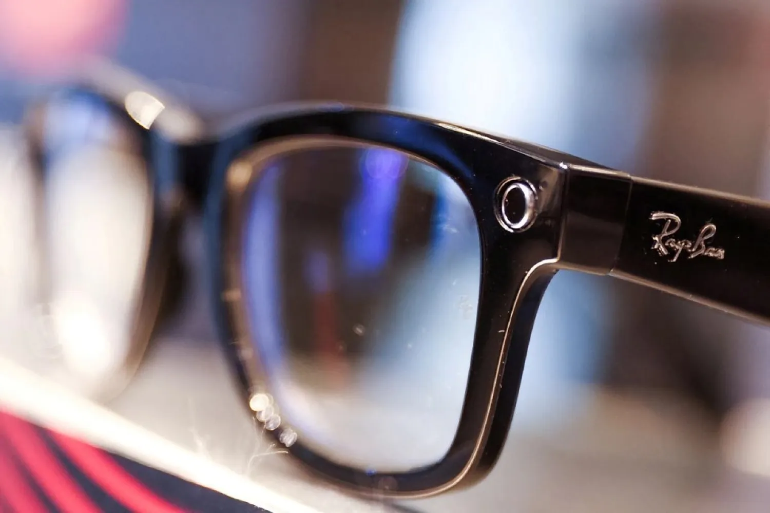A Ray-Ban sunglass frame is pictured for sale in a Sunglass Hut, both brands owned by EssilorLuxottica SA, in Manhattan, New York City, US, November 30, 2021. (Reuters)