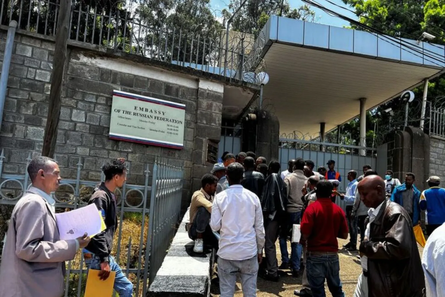 Ethiopian men, drawn by rumors on social media, queue to register to join Russian forces fighting in Ukraine, outside the Russian embassy in Addis Ababa, Ethiopia April 19, 2022. Picture taken April 19, 2022. (Reuters)