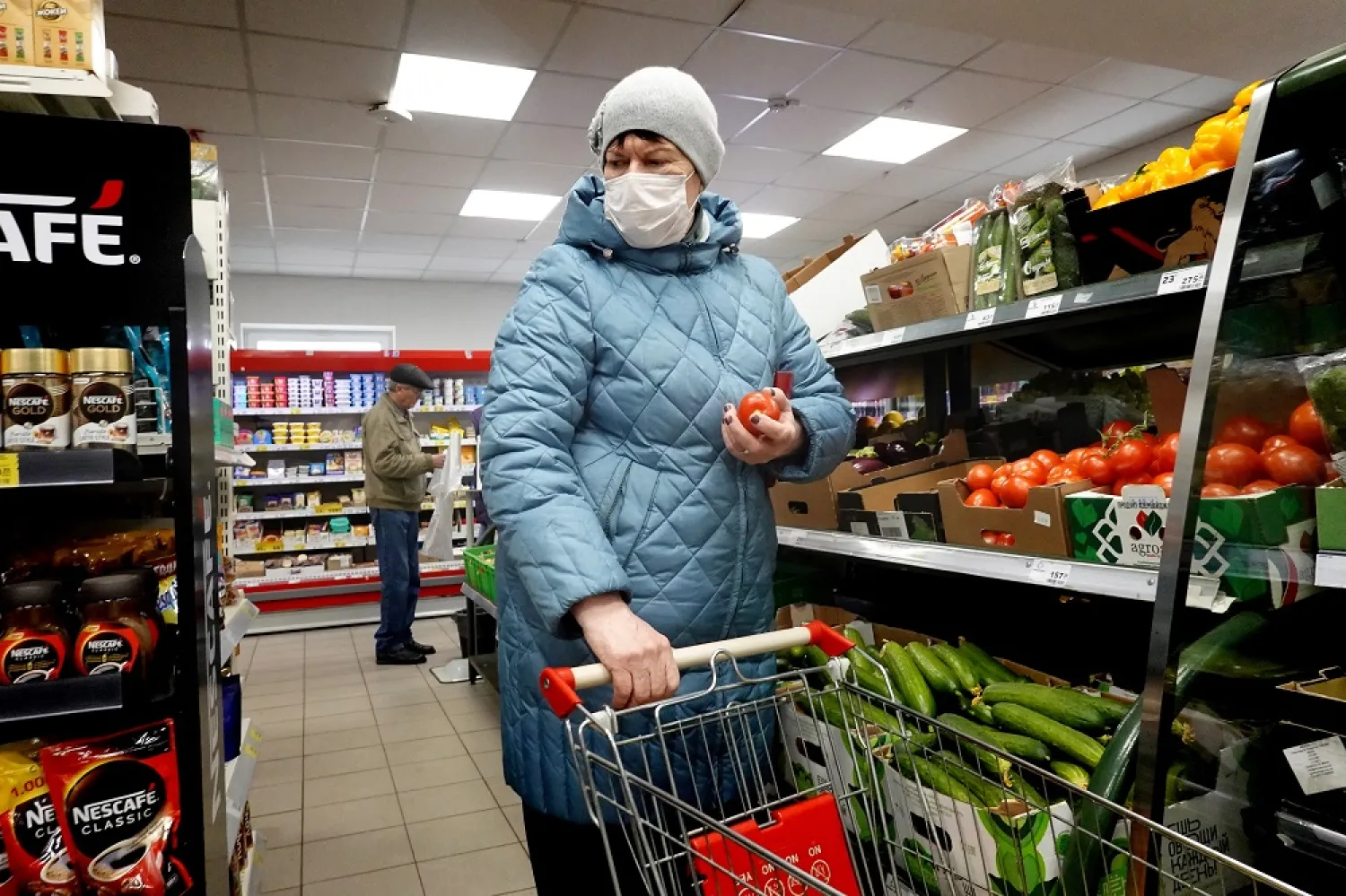 People do shopping at the Russian retailer "Magnit" store, one of the country's major supermarket chains, in Podolsk, outside Moscow, Russia, 21 April 2022. (EPA)