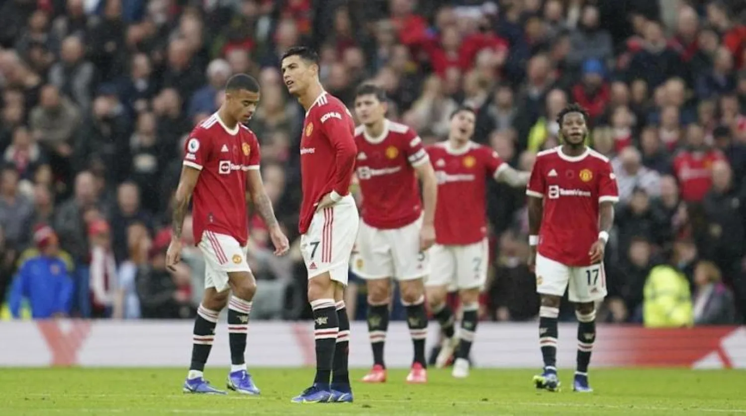 Manchester United players react during the match against City. (AP)
