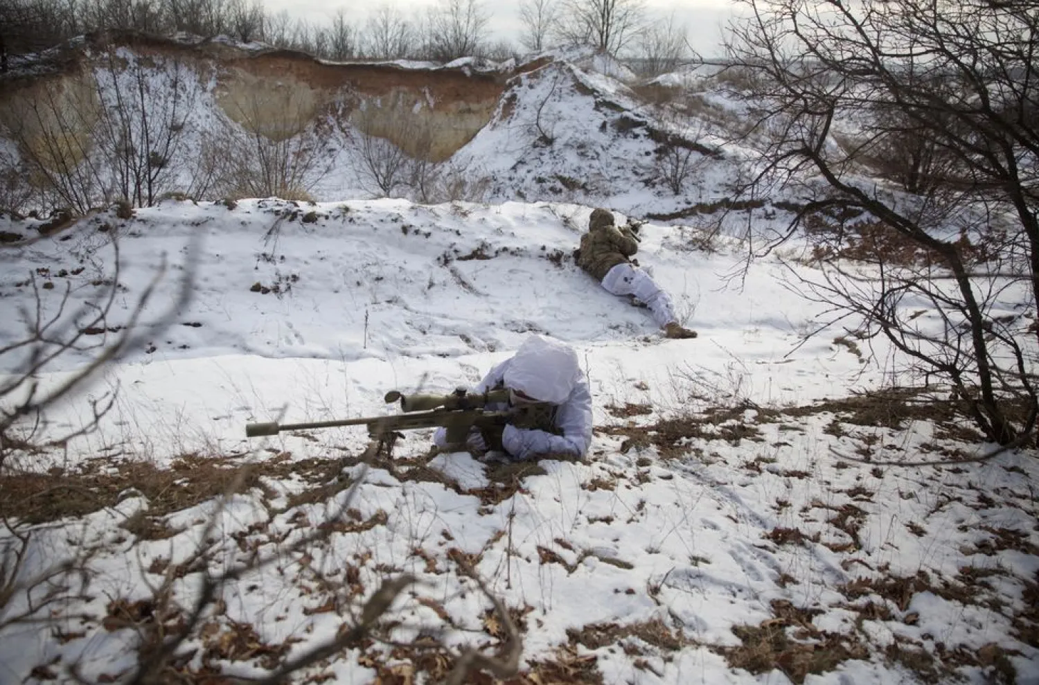 Snipers take part in military exercises at a firing ground of the Ukrainian armed forces in the Donetsk region, Ukraine, January 17, 2022. REUTERS/Anna Kudriavtseva