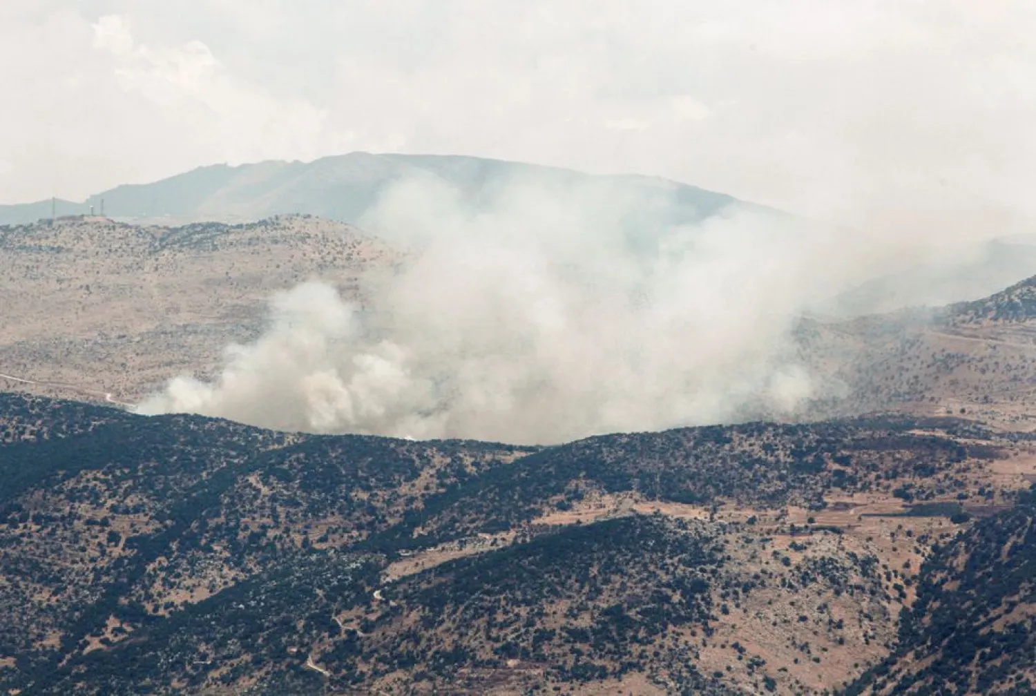 Smoke rises as seen from the village of Wazzani, near the Lebanese-Israeli border in southern Lebanon, August 6, 2021. REUTERS/Aziz Taher