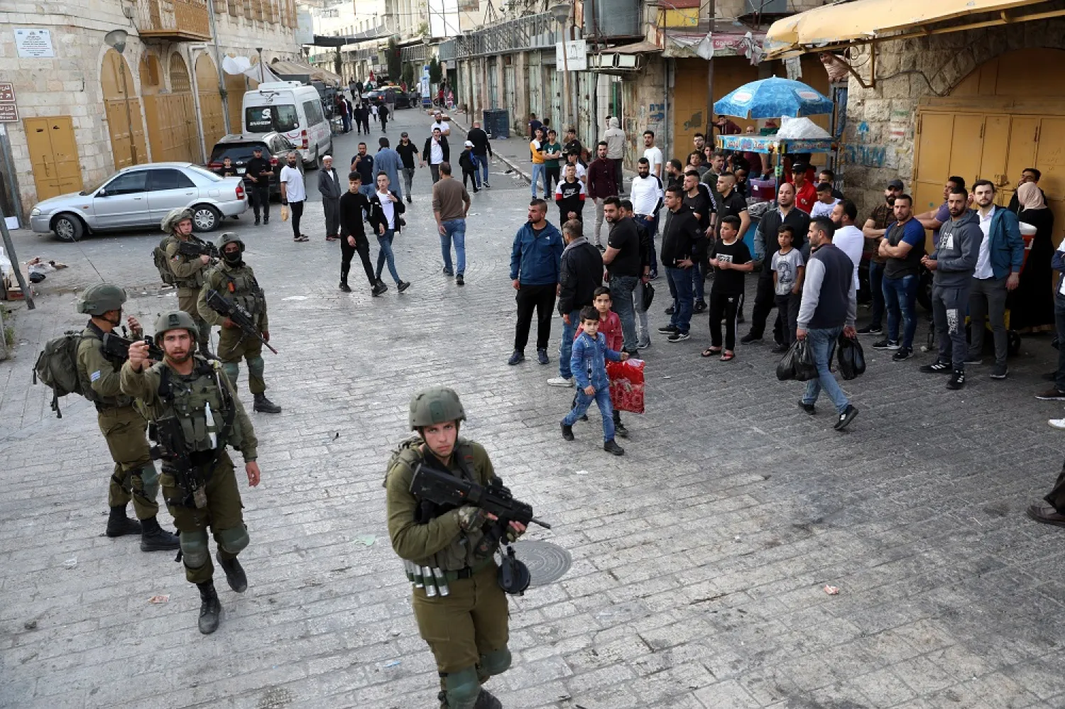 Israeli soldiers during clashes following a protest in the city center of the West Bank city of Hebron, 22 April 2022. (EPA)