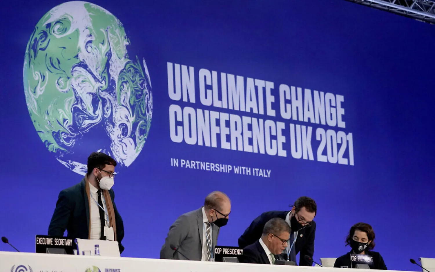 File Photo: Alok Sharma, center seated, President of the COP26 summit attends a stocktaking plenary session at the COP26 UN Climate Summit, in Glasgow, Scotland, Saturday, Nov. 13, 2021 (AP Photo/Alberto Pezzali)
