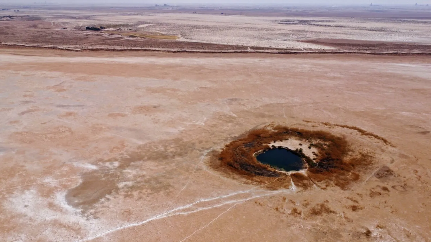 A meagre pond is all that remains of the once flourishing wetlands known as Sawa Lake in southern Iraq's al-Muthanna province (AFP/Asaad NIAZI)
