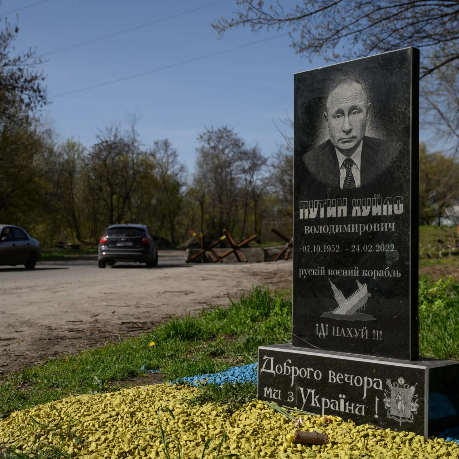 A mock tombstone portraying Russian President Vladimir Putin is displayed on a road outside Zaporizhzhia on April 25, 2022 Ed JONES AFP
