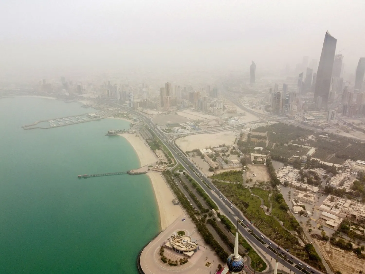 An aerial view shows Kuwait City during a dust storm on April 24, 2022. (AFP)