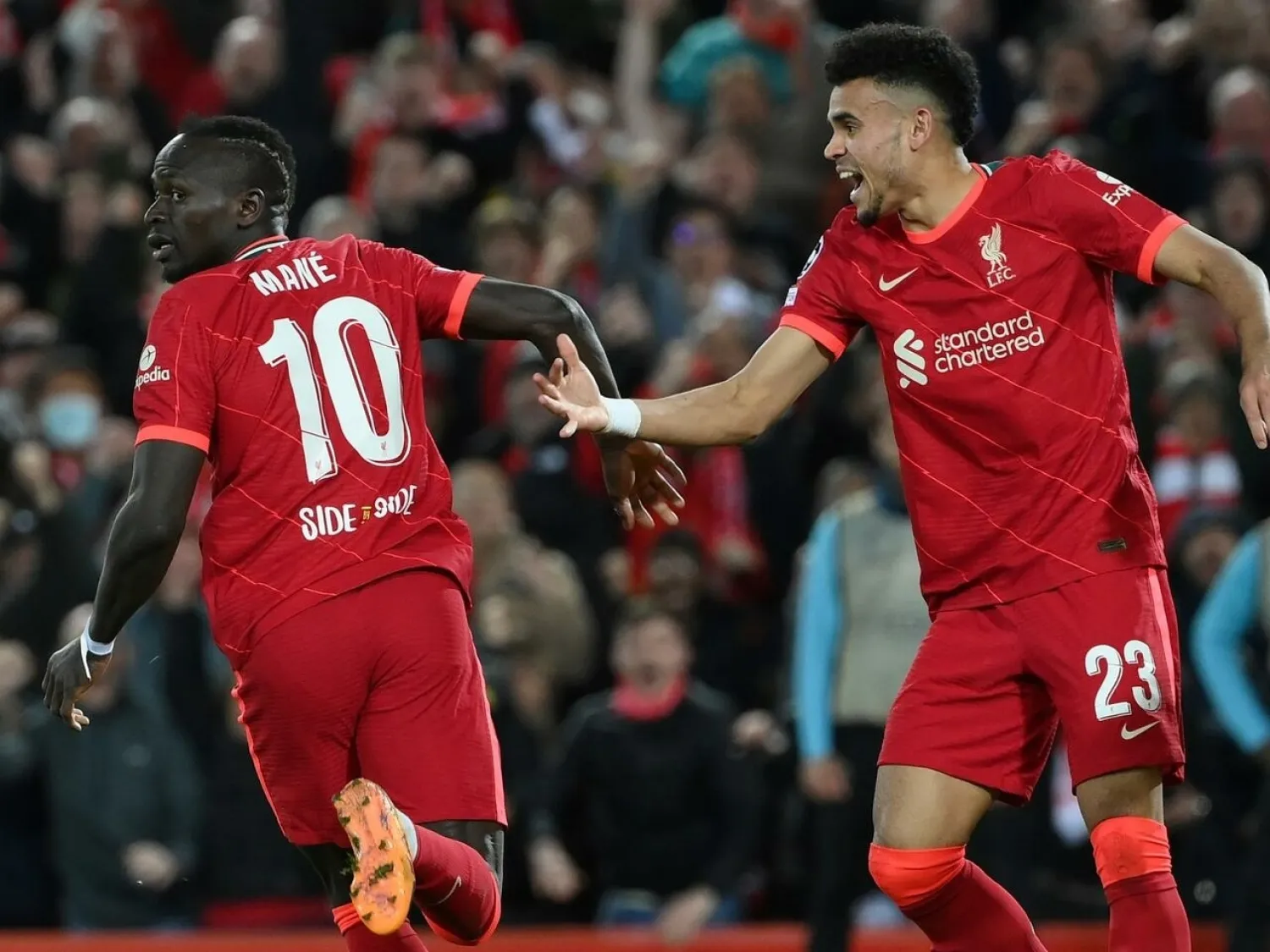 Four-midable: Liverpool remain on course for a quadruple of trophies LLUIS GENE AFP
