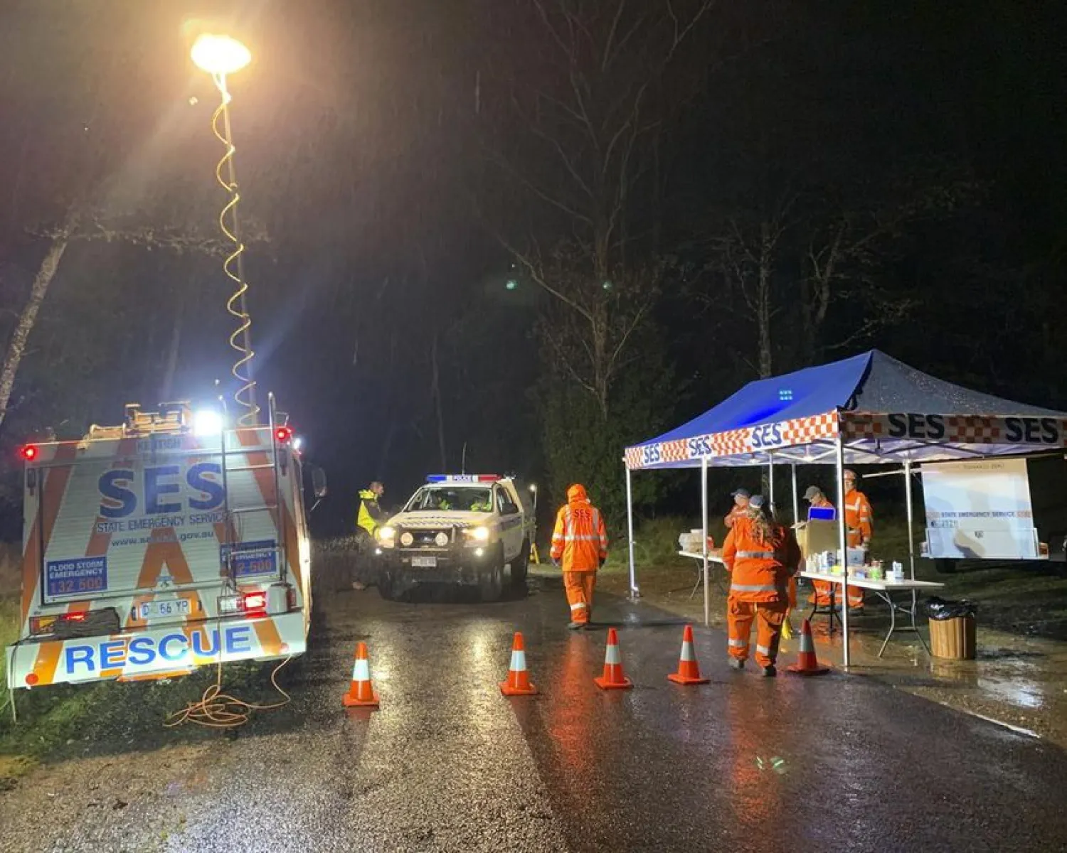 Police block a road, Wednesday, April 27, 2022, after a fatal accident in the Targa Tasmania car rally in Mount Roland, Australia. (Monte Bovill/ABC News via AP)