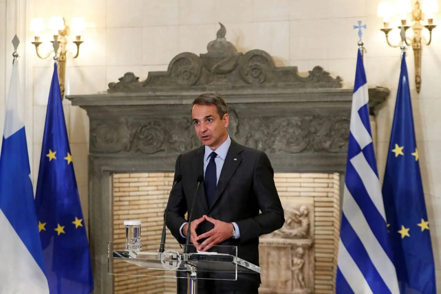 Greek Prime Minister Kyriakos Mitsotakis speaks during joint statements with his Finnish counterpart Sanna Marin at the Maximos Mansion in Athens, Greece, April 28, 2022. (Reuters)