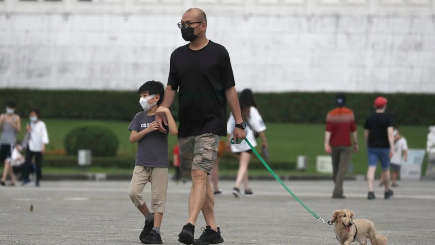 People wear face masks to protect against the spread of the coronavirus in Taipei, Taiwan, Wednesday, April 27, 2022. (AP Photo/Chiang Ying-ying)
