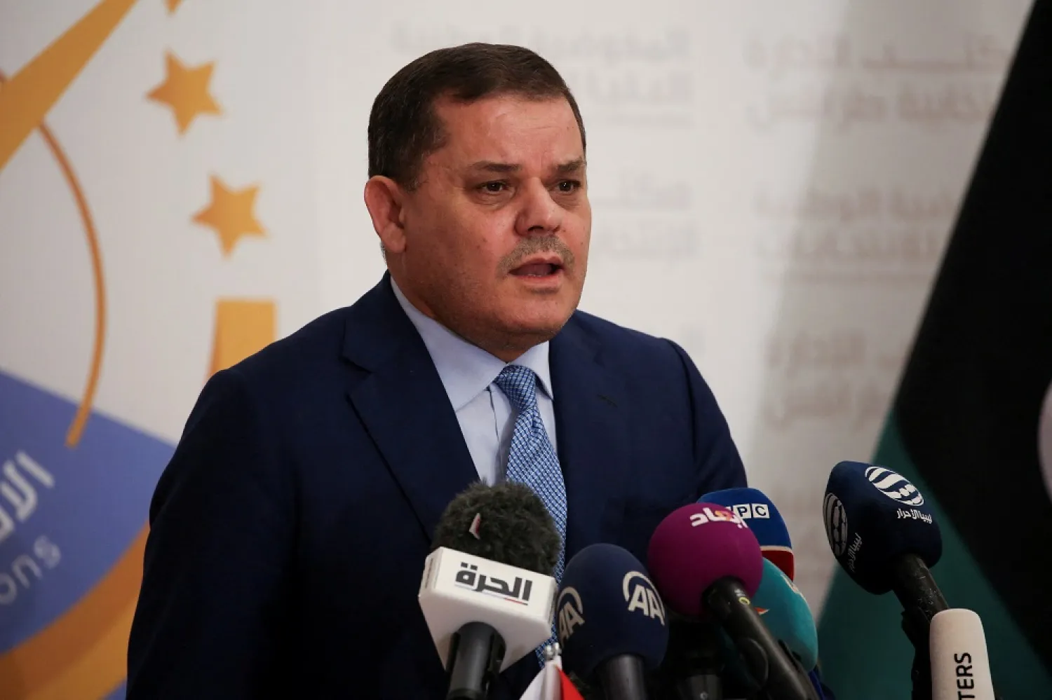 Head of the GNU Abdulhamid al-Dbeibah speaks after submitting his candidacy papers for the upcoming presidential election at the headquarters of the electoral commission in Tripoli, Libya November 21, 2021. (Reuters)