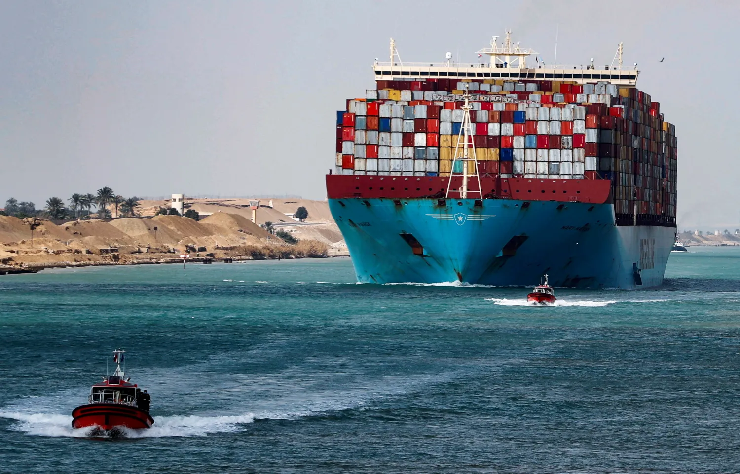 A shipping container passes through the Suez Canal in Suez, Egypt February 15, 2022. Picture taken February 15, 2022. REUTERS/Mohamed Abd El Ghany

