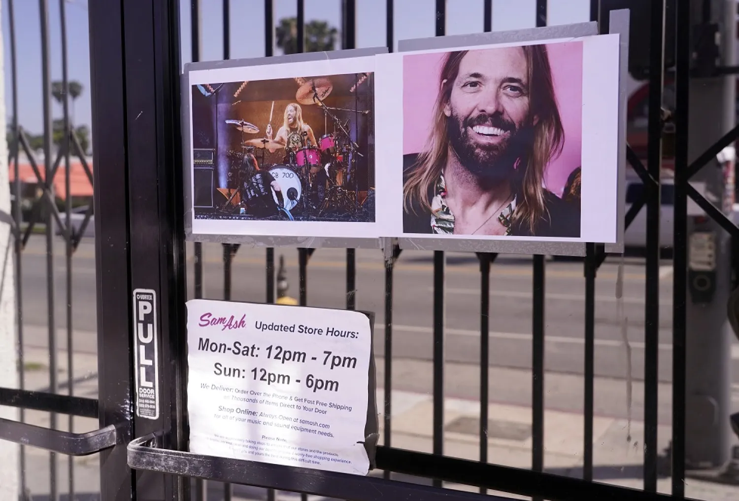 Pictures of the late Foo Fighters drummer Taylor Hawkins adorn the front entrance to Sam Ash Drum Shop, Wednesday, March 30, 2022, in Los Angeles. (AP)