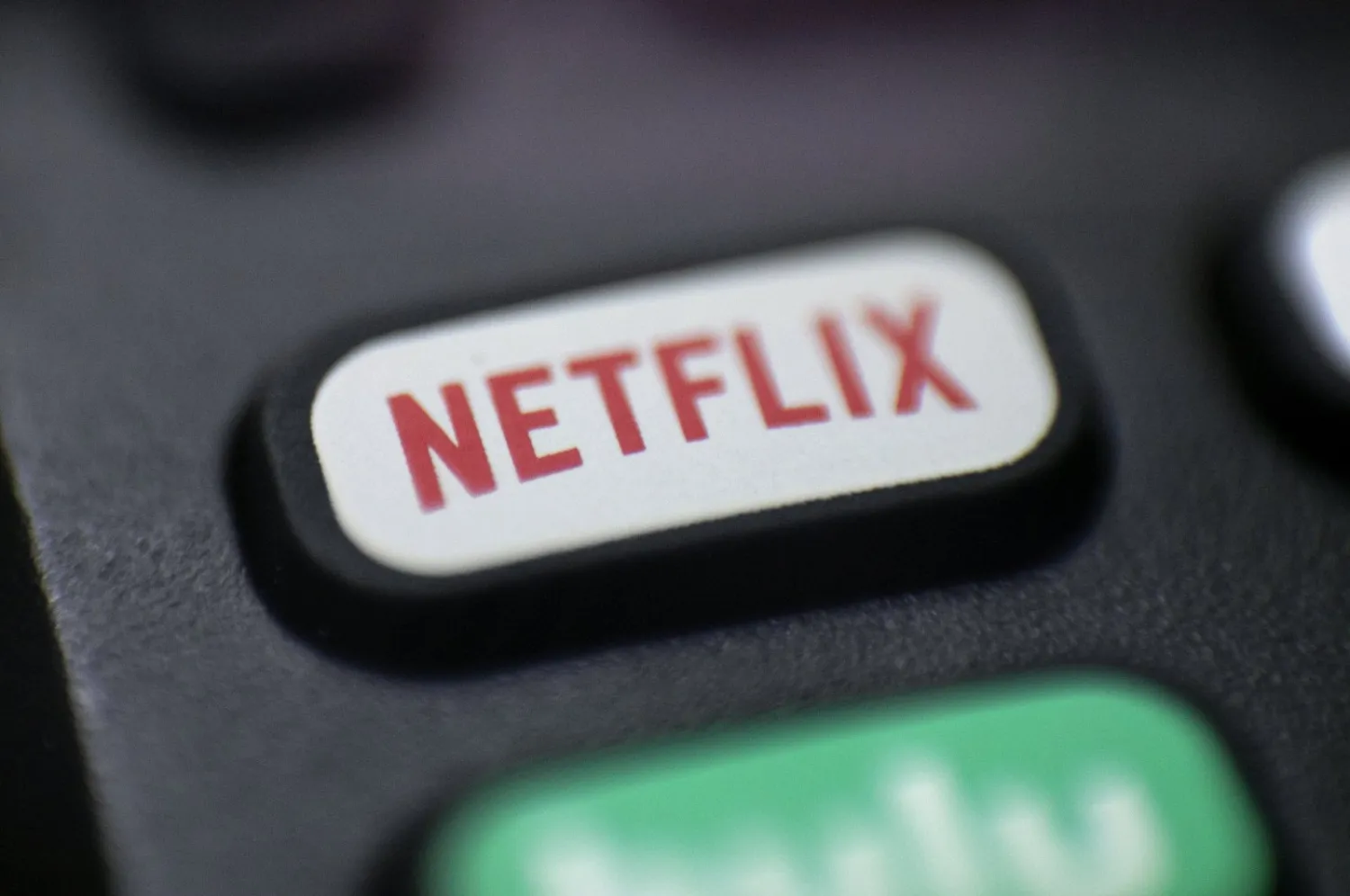 A Netflix logo is seen on a remote control in Portland, Oregon, Aug. 13, 2020. (AP Photo)
