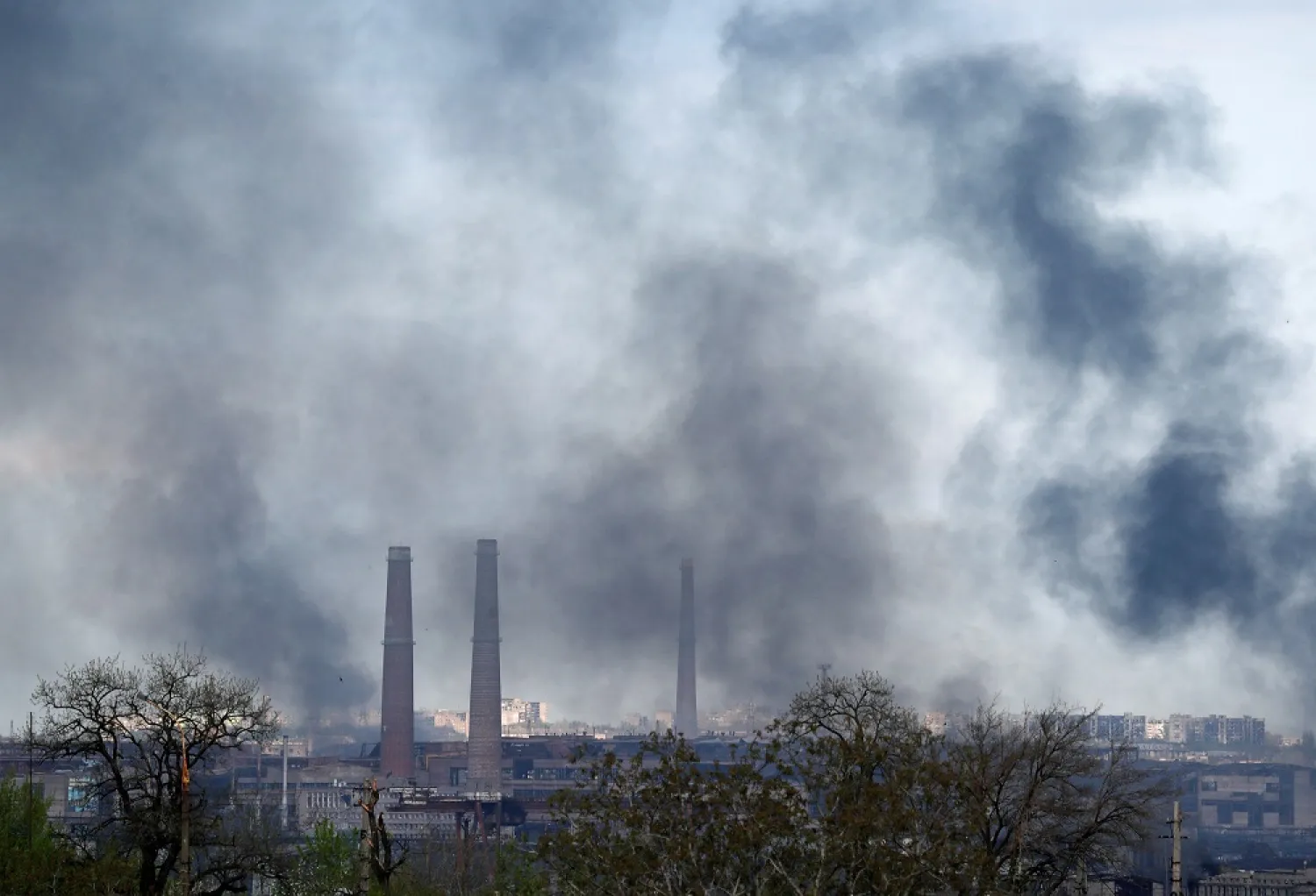 Smoke rises above a plant of Azovstal Iron and Steel Works during Ukraine-Russia conflict in the southern port city of Mariupol, Ukraine May 2, 2022. (Reuters)