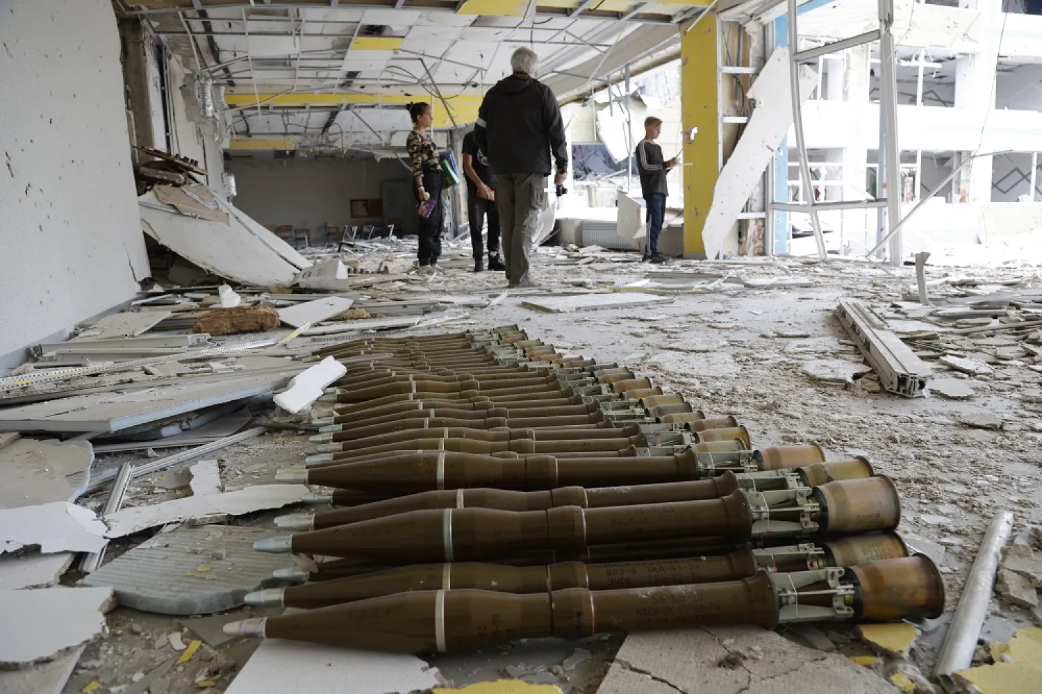 RPG shells lie in the hall of a destroyed school in Mariupol, in territory under the government of the Donetsk People's Republic, eastern Ukraine, Monday, May 2, 2022. (AP)