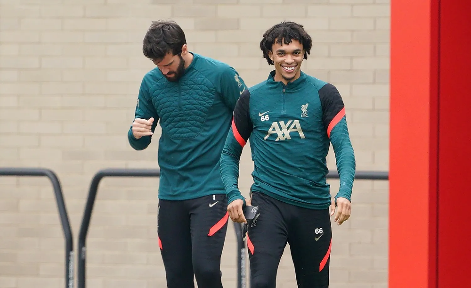 02 May 2022, United Kingdom, Liverpool: Liverpool's Trent Alexander-Arnold (R) and goalkeeper Alisson take part in a training session at the AXA Training Centre ahead of Tuesday's UEFA Champions League semifinal second leg match against Villarreal. (dpa)