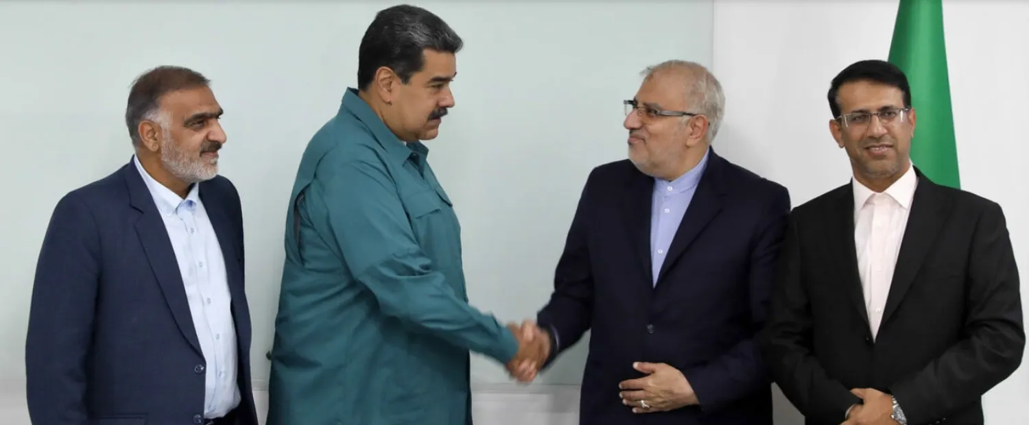 Handout picture released by the Venezuelan Presidency showing President Nicolas Maduro (2-L) shaking hands with Iran's Oil Minister Javad Owji (2-R) during his visit to Miraflores Presidential Palace for a private meeting in Caracas on May 2, 2022 - Venezuelan Presidency/AFP