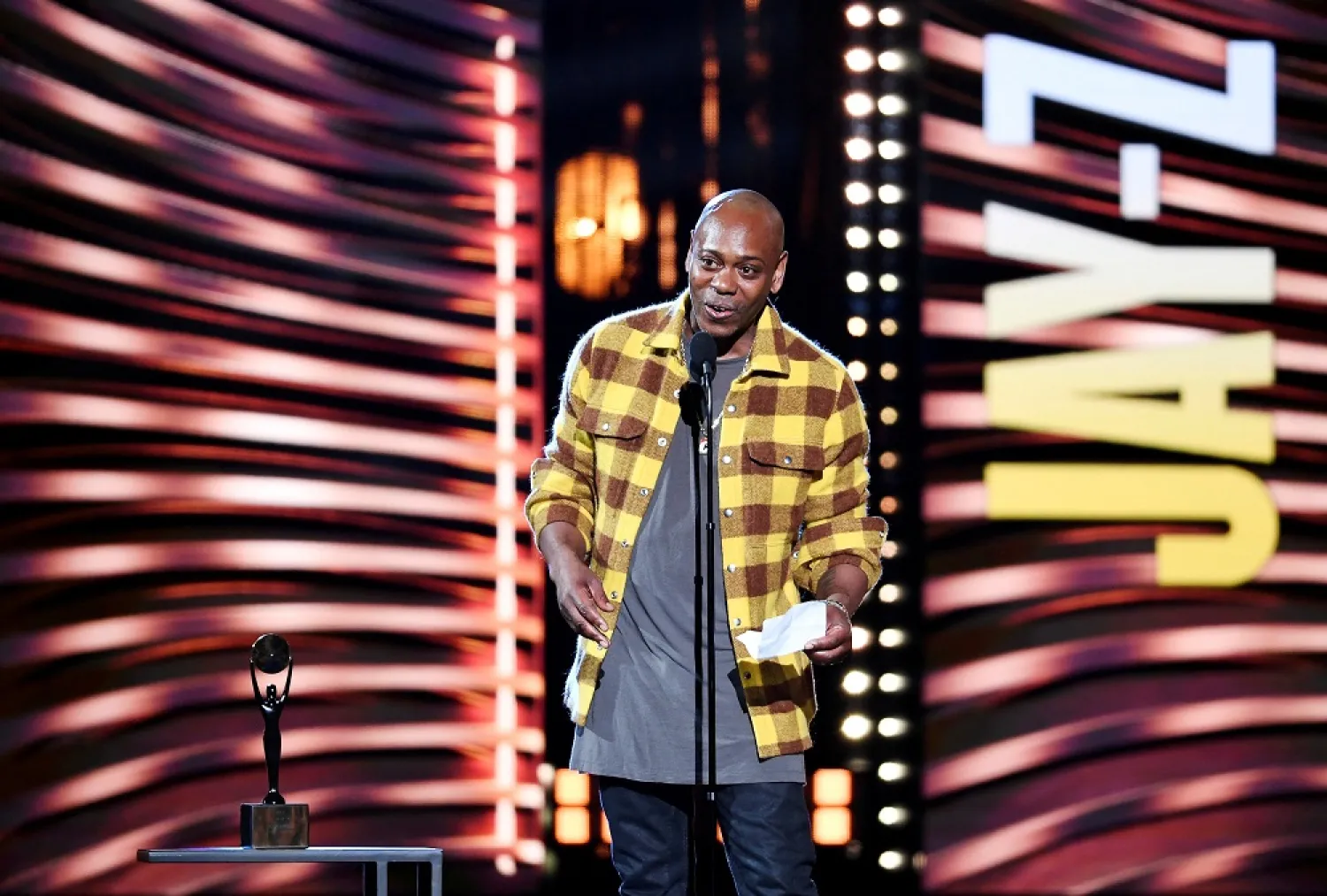 Dave Chappelle introduces Jay-Z during the Rock and Roll Hall of Fame induction ceremony in Cleveland, Ohio, US October 30, 2021. (Reuters)