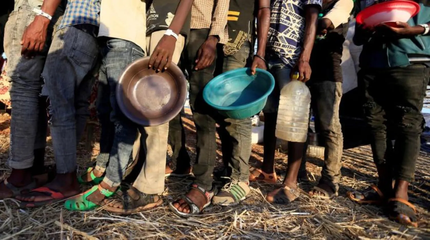 File Photo: Ethiopian refugees who fled Tigray region, queue to receive food aid within the Um-Rakoba camp in Al-Qadarif state, on the border, in Sudan December 11, 2020. REUTERS/Mohamed Nureldin Abdallah/File Photo

