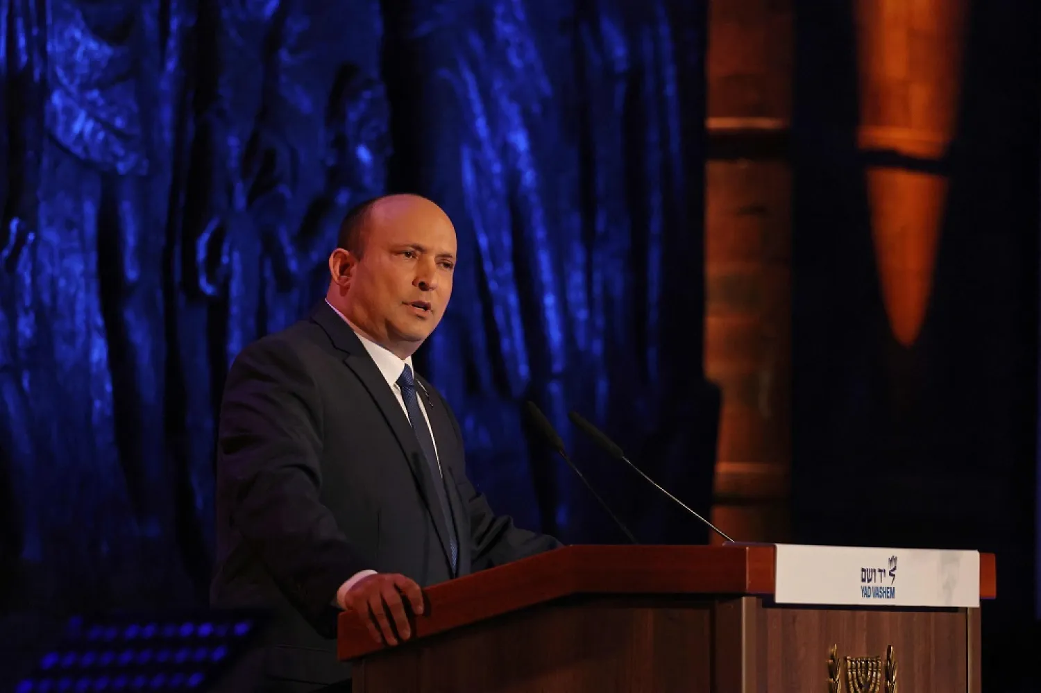 Israeli Prime Minister Naftali Bennett delivers remarks during a ceremony marking the Holocaust Remembrance Day at Israel's Yad Vashem Holocaust memorial in Jerusalem, on April 27, 2022. (AFP)