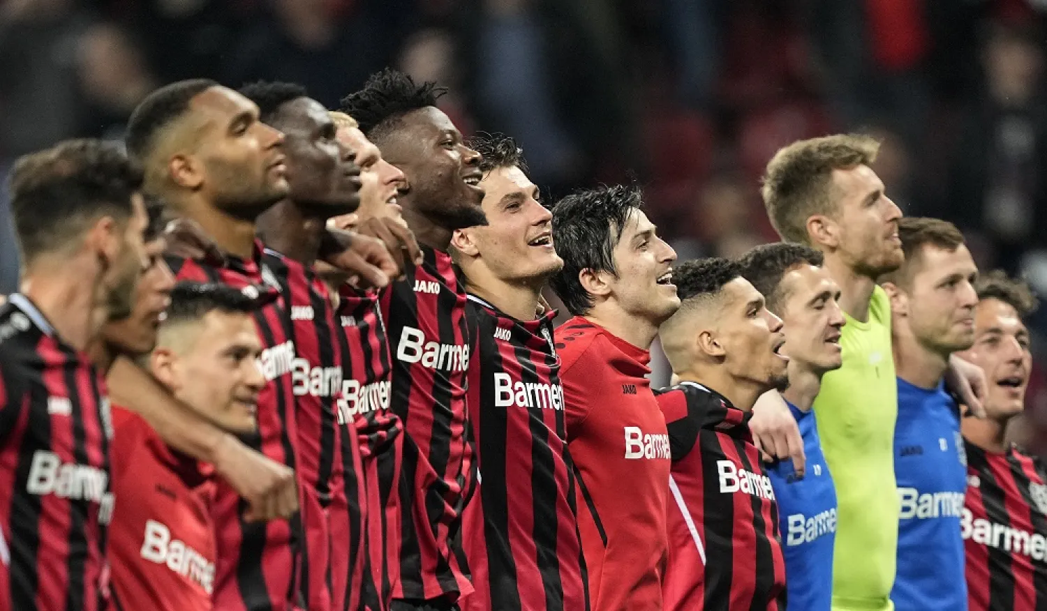 Leverkusen's Patrik Schick, center, celebrates with the team after winning the German Bundesliga match between Bayer Leverkusen and Eintracht Frankfurt in Leverkusen, Germany, Monday, May 2, 2022. (AP)