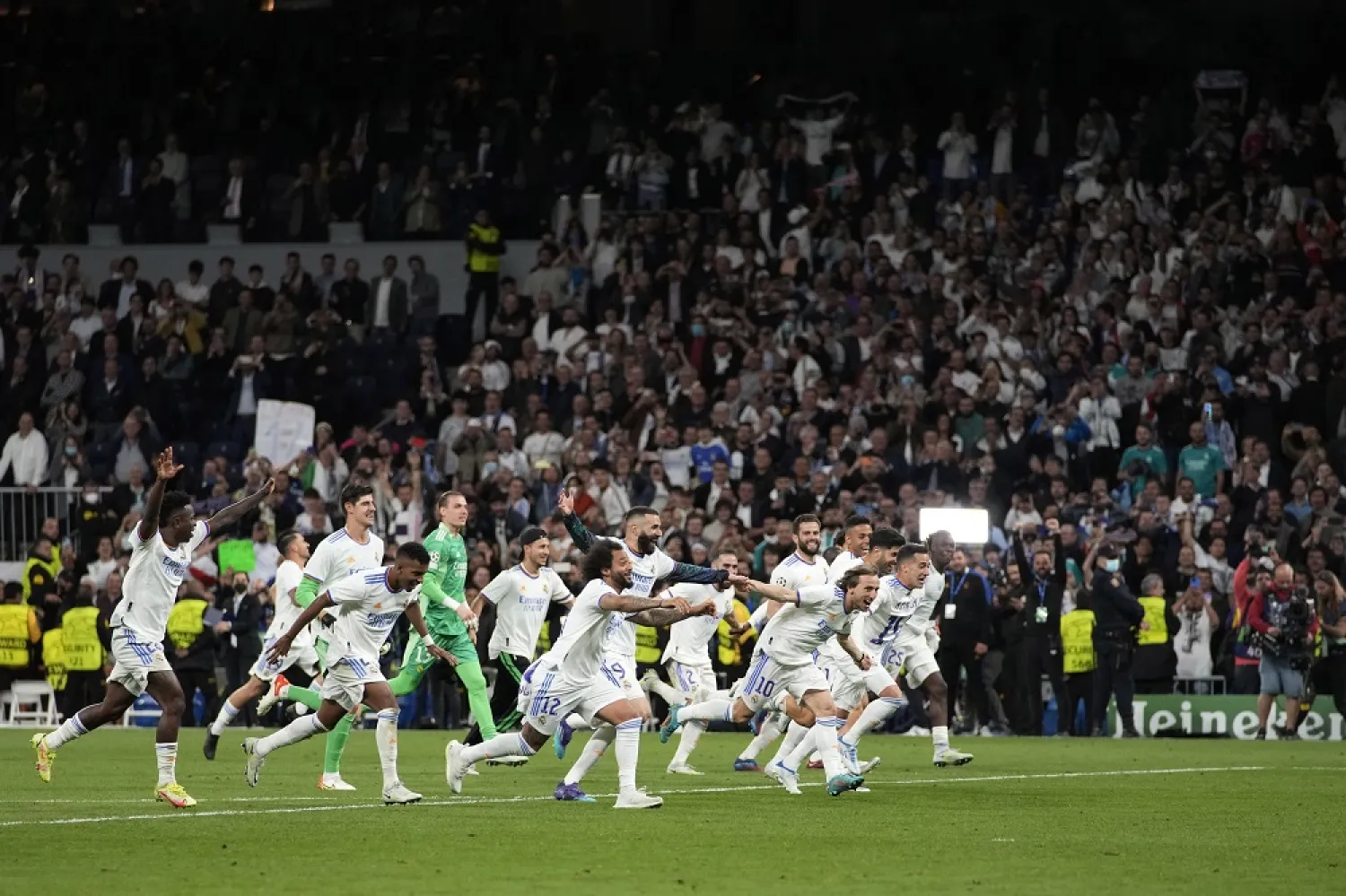Real Madrid players celebrate after the Champions League semifinal, second leg, match between Real Madrid and Manchester City at the Santiago Bernabeu stadium in Madrid, Spain, Wednesday, May 4, 2022. (AP)