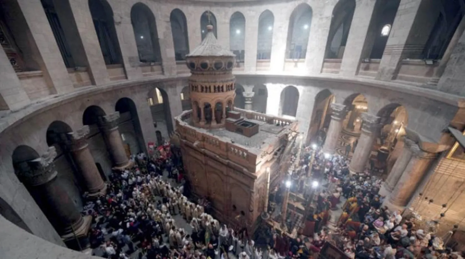 Orthodox Christians celebrate Palm Sunday at the Church of the Holy Sepulcher in Jerusalem on April 17, 2022. (AP) 
