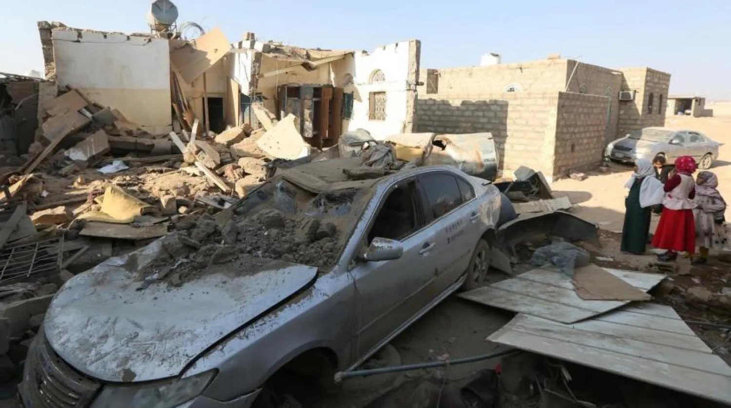 People stand at the site of a Houthi ballistic missile attack over the populated district of Rawdha in Marib (File photo: Reuters)