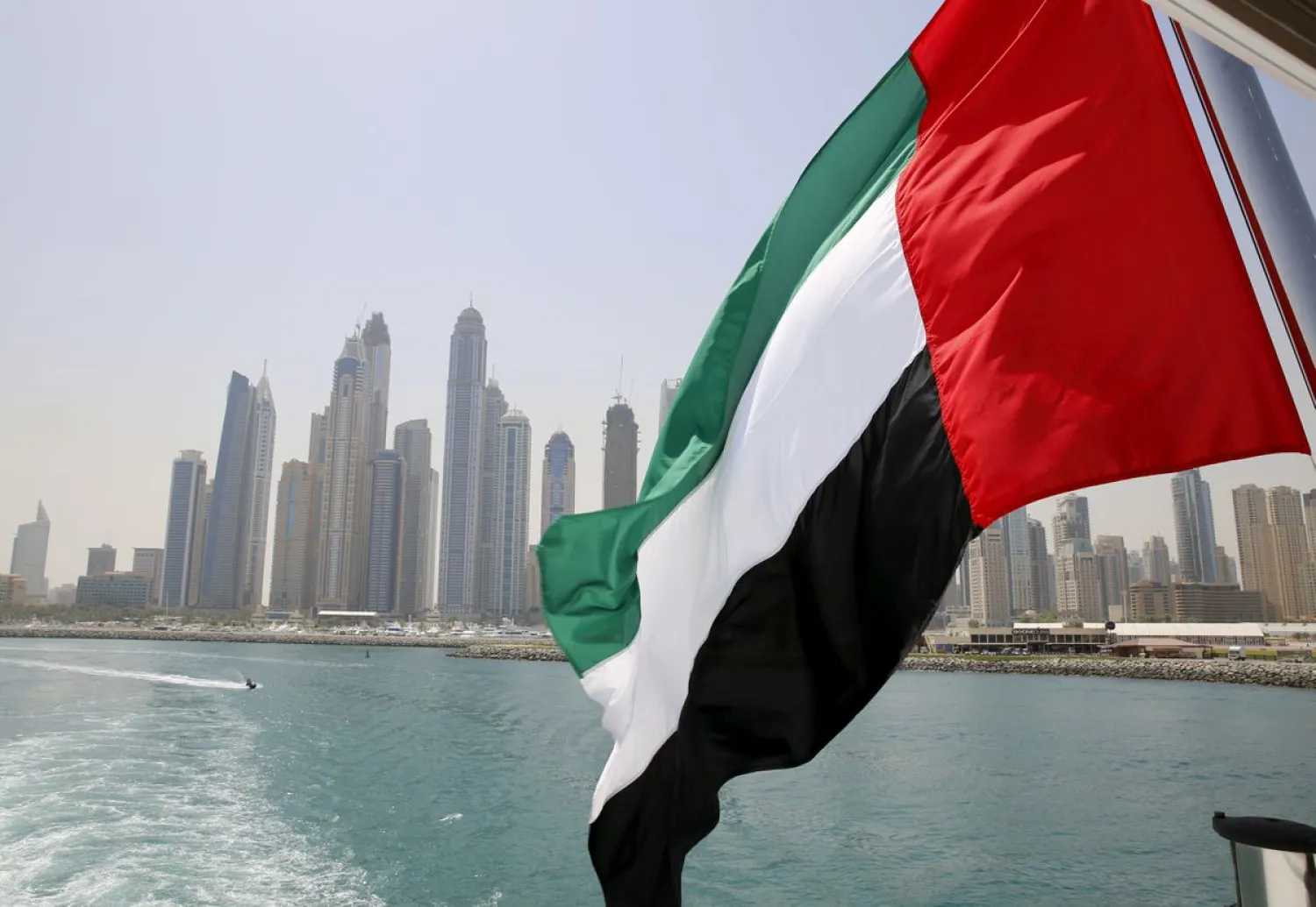 UAE flag flies over a boat at Dubai Marina, Dubai, United Arab Emirates May 22, 2015. REUTERS/Ahmed Jadallah/File Photo