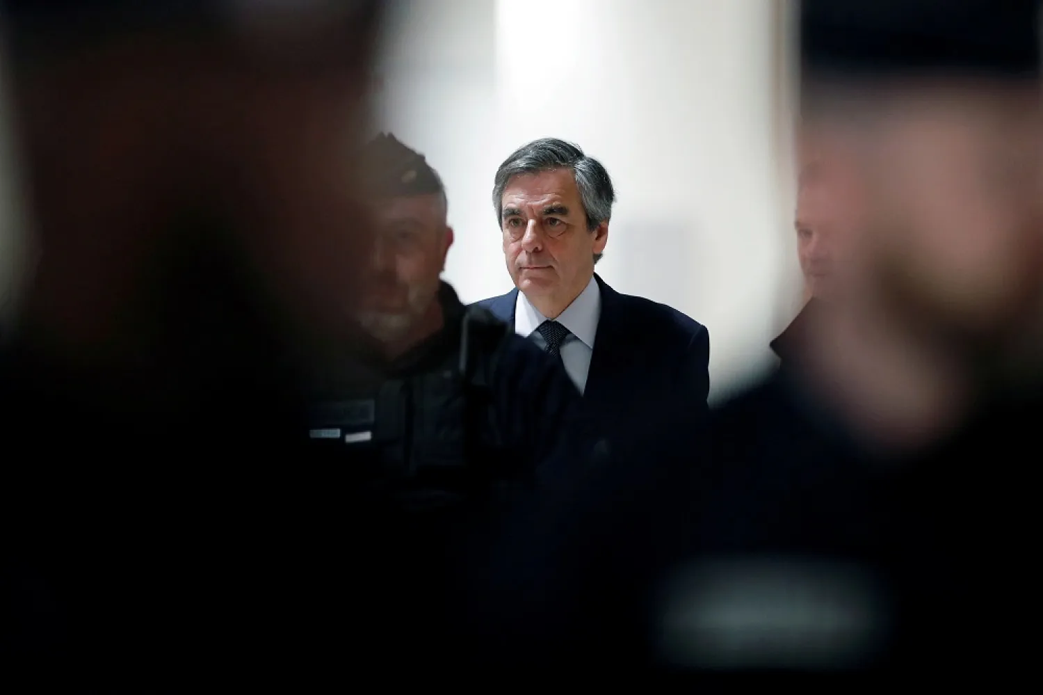 A French appeals court upholds former Prime Minister Francois Fillon's conviction for embezzling public funds, but cut a year off his prison term. (Reuters)