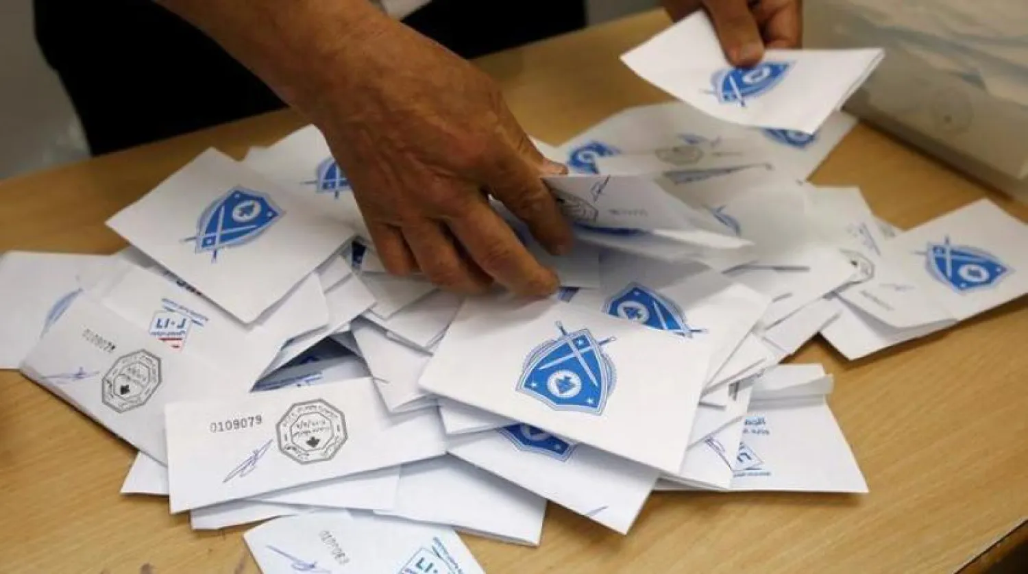 A Lebanese election official counts ballots after the polling station closed during Beirut’s municipal elections in Lebanon, May 8, 2016. REUTERS/Mohamed Azakir
