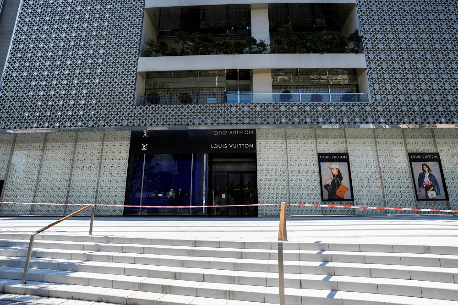 A closed store of French luxury brand Louis Vuitton is pictured during lockdown, amid the coronavirus disease (COVID-19) pandemic, in Shanghai, China, May 6, 2022. (Reuters)